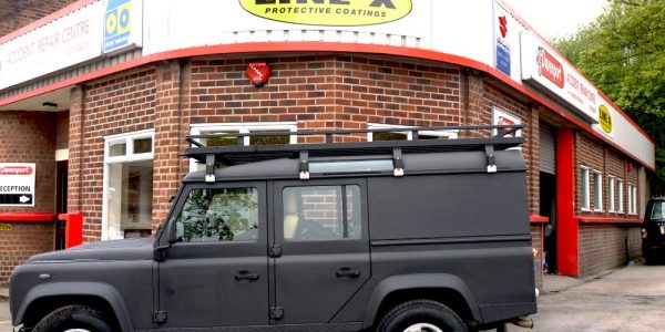 LINE-X Mansfield dealership shopfront with a coated Land Rover Defender