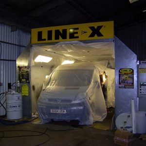 Window cleaner van being prepared for LINE-X lining