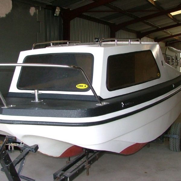 Boat hull coated with LINE-X protective coating