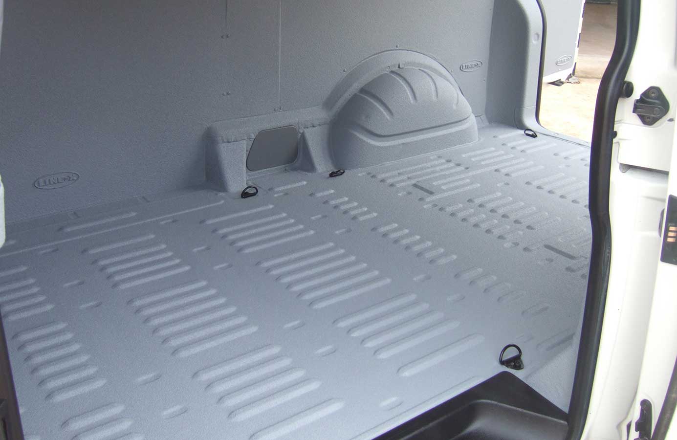 Van cargo area sprayed with LINE-X protective lining